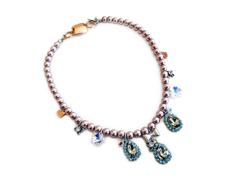 Beaded necklace with light blue rhinestones, silver plated brass and small charms. - Maiden-Art